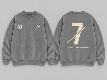 Front and back views of grey washed oversized sweatshirt with number 7 graphic
