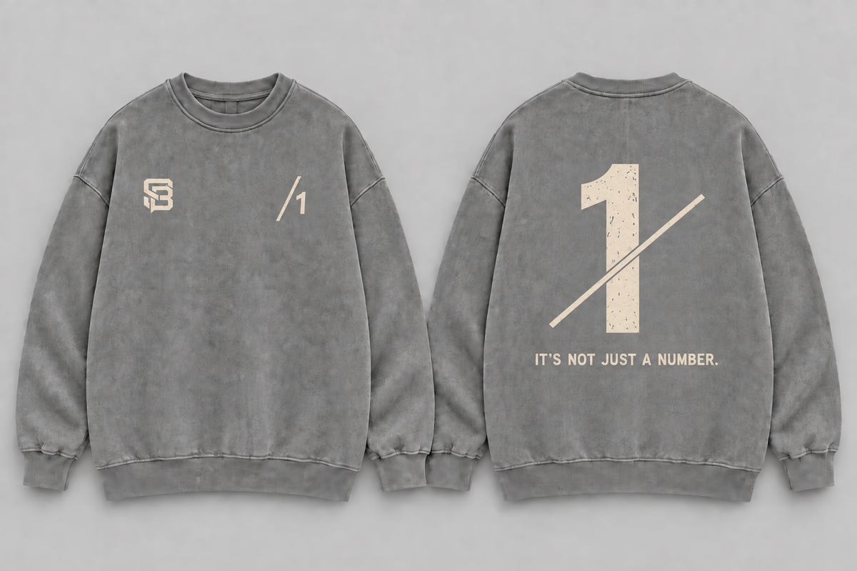 Front and back views of grey washed oversized sweatshirt with number 1 graphic