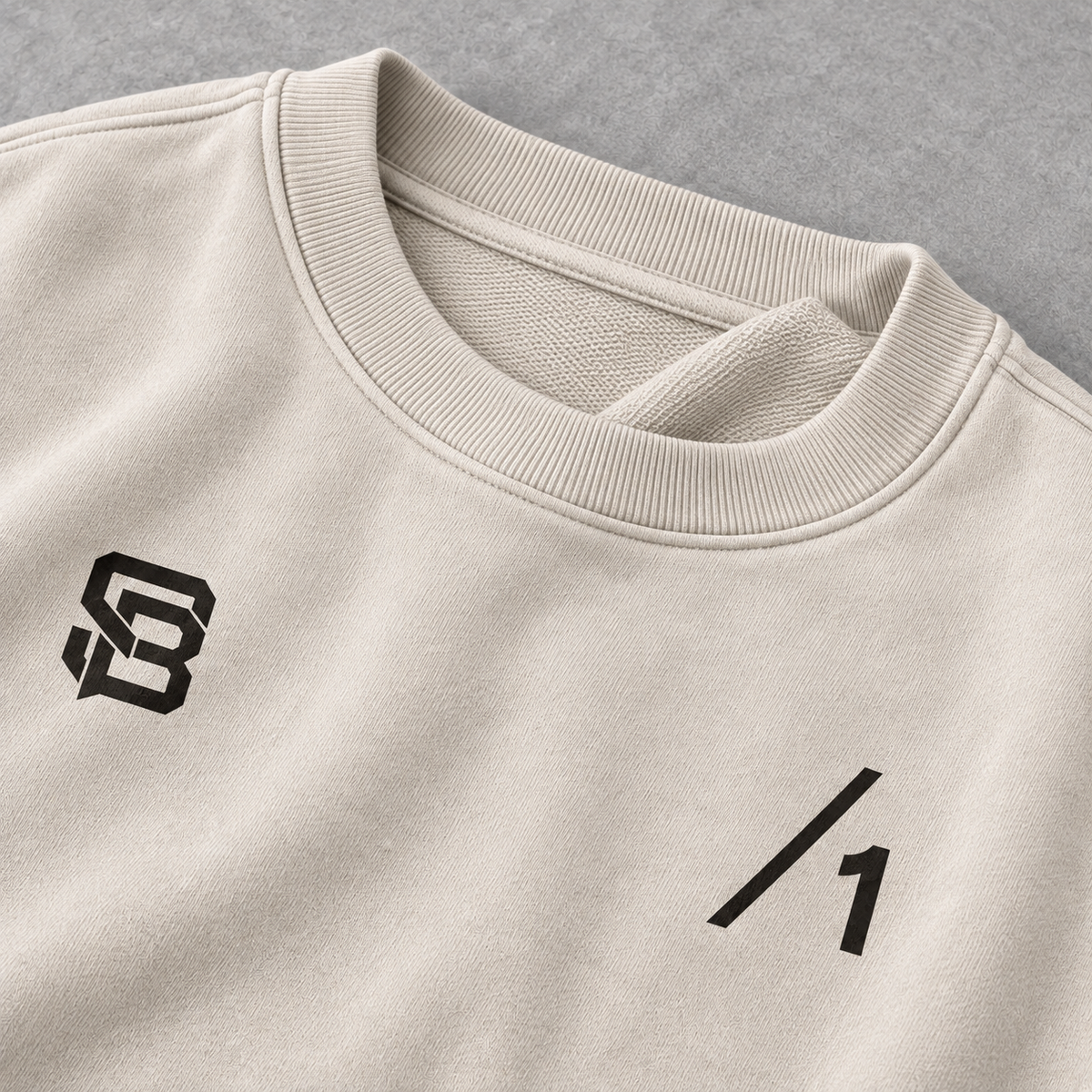 Close-up of the front chest print on off-white oversized sweatshirt