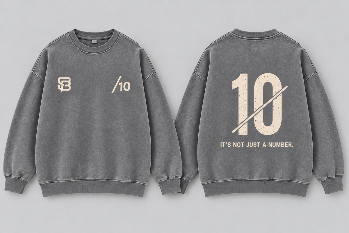 Front and back views of grey washed oversized sweatshirt with number 10 graphic