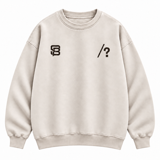 Close-up of customizable question mark graphic on the front of a cream oversized sweatshirt