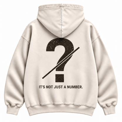 Close-up of customizable question mark graphic on the back of a cream oversized hoodie