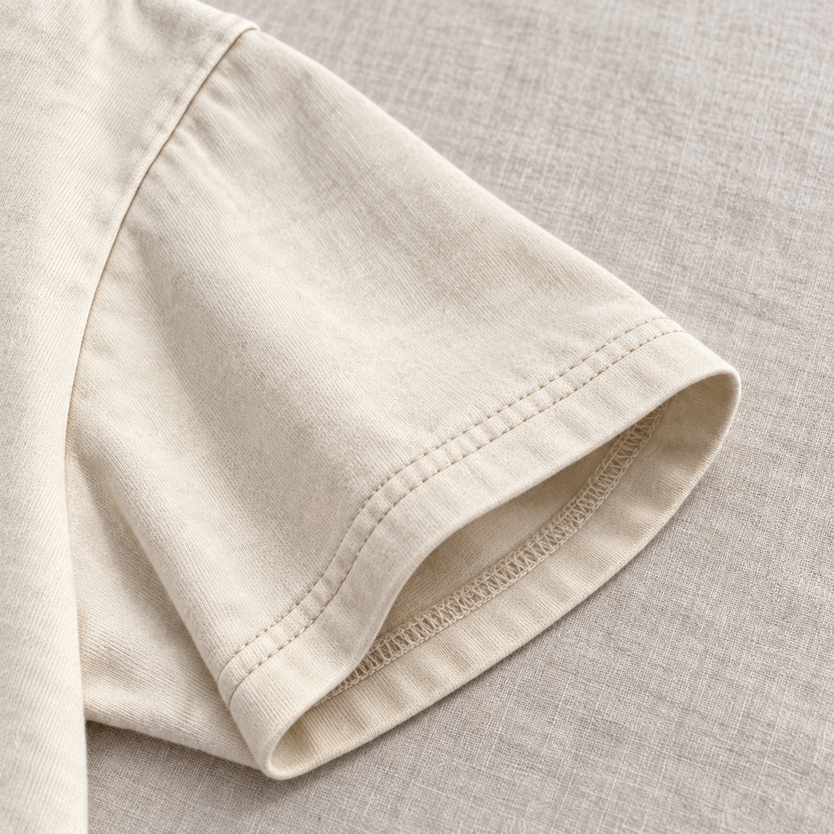 Close-up of the sleeve stitching on off-white oversized T-shirt